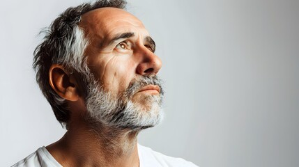 Wall Mural - Close Up Portrait of a Mature Man with a White Beard Looking Upwards