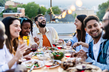 Wall Mural - Happy diverse group of friends enjoying dinner barbecue in summer at home terrace.