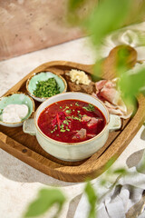 Wall Mural - Authentic borscht with salo Sunlit Still Life Captures Rustic Aesthetic and Natural Texture