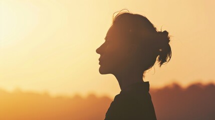 Poster - Professional woman in silhouette against a natural backdrop.