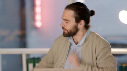 Poster - Angry young businessman feeling stress and the pressure of deadlines while working late on his laptop. Web developer getting upset about failure and mistake while banging his desk in frustration