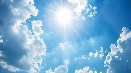 Wall Mural - bottom up view of blue sky with shining sun white fluffy clouds on a blue sky in spring season : gen
