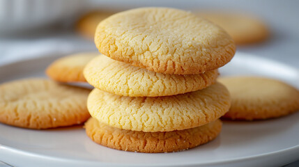 Canvas Print - Several plain round cookies stacked on a white plate