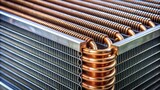 Close up of a threaded steel coil cooler in an air conditioner unit , coil, cooler, air conditioner, HVAC