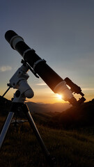 Wall Mural - Preparing for night sky observing with a astronomical telescope just before sunset.