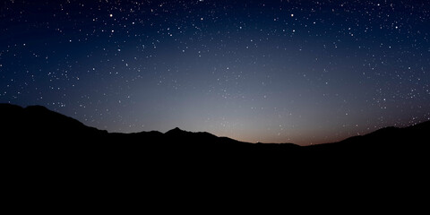 Wall Mural - a night sky panorama with stars and moon