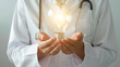 © Creative mind - Concept of idea generation in medicine and innovative healthcare with doctor holding illuminated light bulb.