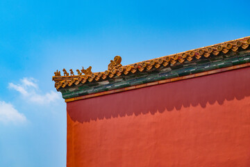 Wall Mural - background of red wall and eave of forbidden city and blue sky