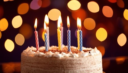 Wall Mural - Sparkling Moments A Birthday Cake Surrounded by Candlelight and Bokeh