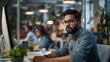 © inthasone - Portrait of a South Asian Financial Securities Trader Working on Desktop Computer in a Modern Office. Handsome Indian Accountant Bookkeeping Financial Affairs of a Business Venture