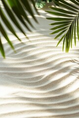 Wall Mural - A leafy green palm tree is in the foreground of a sandy beach. The palm tree is casting a shadow on the sand, creating a sense of depth and dimension. The image evokes a feeling of relaxation