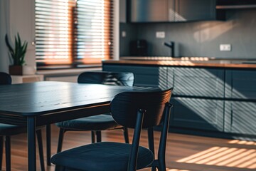 Beautiful black table with two chairs in modern kitchen, background image