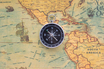Wall Mural - classic round compass on background of old vintage map