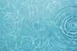 © kenkuza - Blue water texture, mint blue water surface with rings and ripples