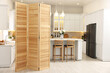 © New Africa - Stylish kitchen interior with folding screen and table