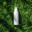 © Natalia - White plastic pump bottle on fresh green grass, natural cosmetic packaging, eco-friendly branding concept