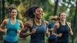 © Business Pics - A diverse group of people running outdoors, smiling and laughing together in an active fitness class