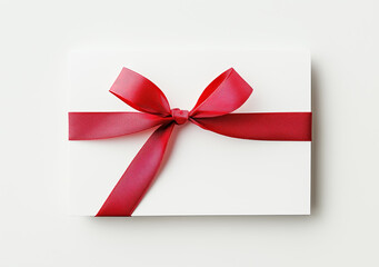 White card with red ribbon on isolated background, close up view, Blank Greeting and note for celebration or business gift decoration with copy space. 