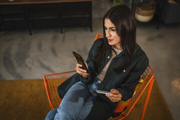 Adult woman enjoy buy online with credit card on mobile phone at home