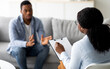© Prostock-studio - Psychological assistance. Millennial black man with depression having counseling session with therapist at office. Desperate young guy with emotional problem receiving help from psychiatrist at clinic