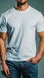 © Uliana - A white t-shirt mockup with a young man in jeans, hands in pockets, against a simple background, shot with natural light.