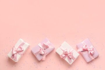 Wall Mural - Gift boxes with beautiful bows and confetti on pink background