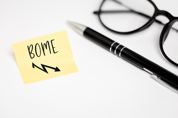 A yellow sticky note on a white background with a handwritten inscription 