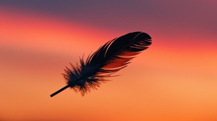 Poster - A single feather floats gently in the air as the sun sets, with warm orange and yellow hues