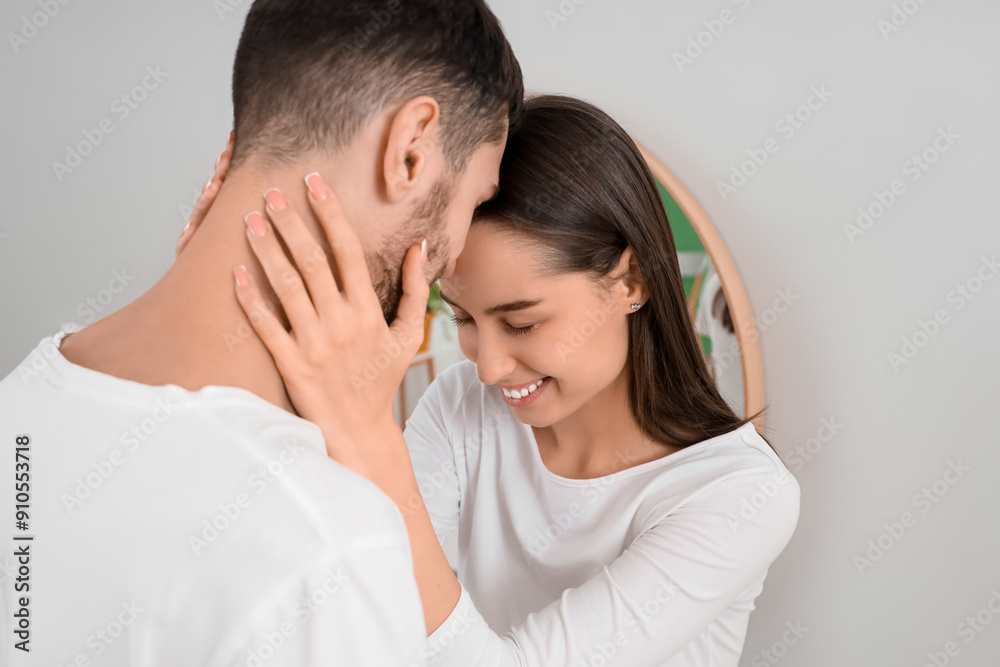 Happy young couple in bathroom