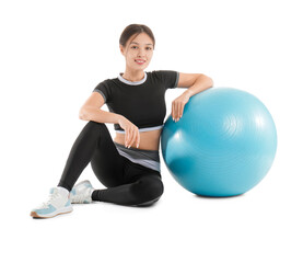 Sporty young Asian woman with fitball on white background