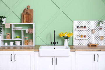 Wall Mural - Stylish kitchen with white counters, closeup