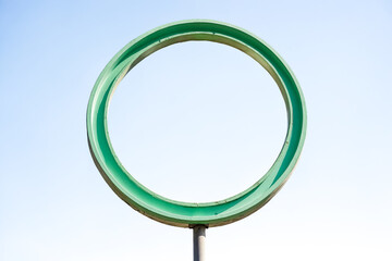 Wall Mural - Green Circle Against Blue Sky