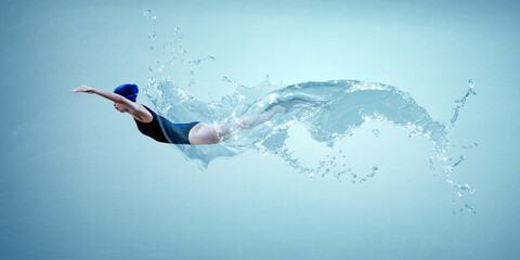 Professional woman swimmer on a wave