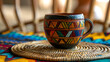 © Jaan - Close-Up of a Unity Cup on a Kwanzaa Straw Mat, Festive Holiday Setup, Generative Ai