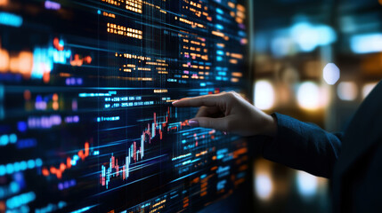Aufkleber - A person is pointing at a screen with a lot of numbers and lines. Concept of focus and concentration as the person is trying to understand the data displayed on the screen