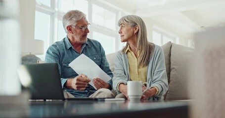 Poster - Senior couple, documents and discussion with laptop for financial expenses or bills at home. Elderly man and woman discussing paperwork with internet on sofa for finance, retirement or pension fund