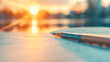 © Hoody Baba - A closeup of a silver fountain pen resting on a notebook open to handwritten notes bathed in golden evening light evocative of inspiration ideas planning and productivity