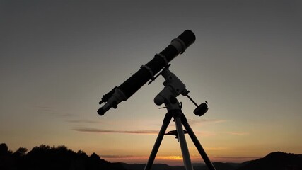 Wall Mural - Preparing for night sky observing with a astronomical telescope just before sunset.	
