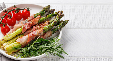 Wall Mural - Grilled asparagus with bacon and egg sauce on a plate