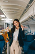 © ARMMY PICCA - Asian young women passenger walk in airport terminal to boarding gate. Attractive beautiful female tourist friends feeling happy and excited to go travel abroad by airplane for holiday vacation trip.