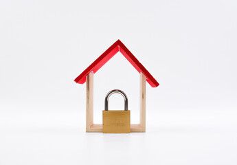 A wooden house and padlock. Isolated with white background.