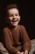 © alexkoral - Portrait of a happy smiling stylish white caucasian child boy kid preschooler a chair