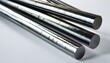 © 克 杜 - Several bright silver metal pipes are neatly arranged on a white background, smooth and shiny.