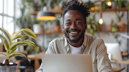 Aufkleber - Happy smiling black man at home, working on laptop in beautiful home interior office. Generative AI.