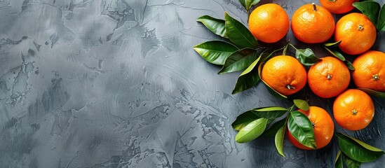 Poster - Tasty tangerines on a grey backdrop with copy space image