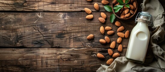 Aufkleber - Rustic wooden table with almonds almond milk bottle and copy space image