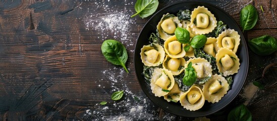 Poster - Top view of traditional Italian tortelli pasta filled with spinach and cheese with copy space image available