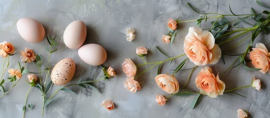 Wall Mural - Trendy colors highlight an organic Easter card with natural eggs and peach Eustoma flowers on a gray background Square format offers copy space image