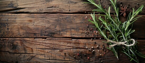 Aufkleber - Rosemary is tied to a wooden surface with spices surrounding it creating a visually appealing copy space image from a top down perspective