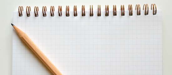 Poster - A focused view of a spiral notepad with a blank space for writing or drawing suitable for a copy space image